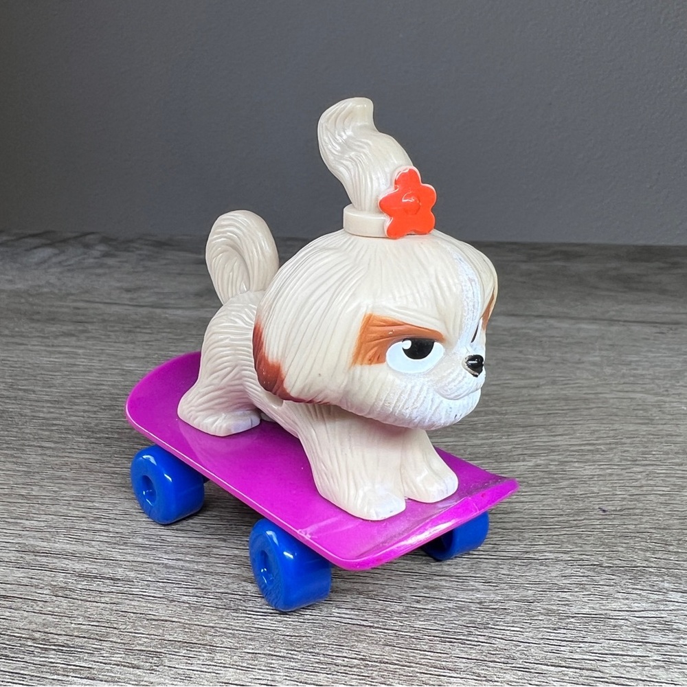 Universal The Secret Life of Pets Daisy Dog Skateboard Cake Topper 3”